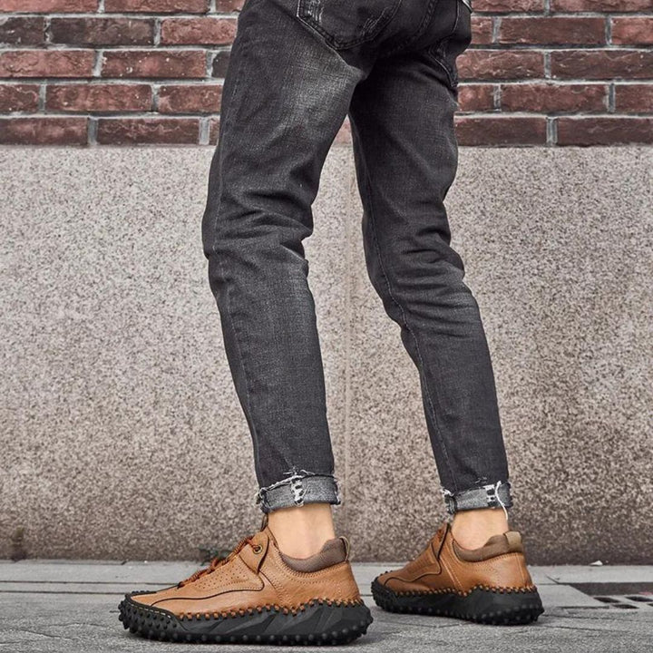 Robust outdoor lace-up shoes with studded tread