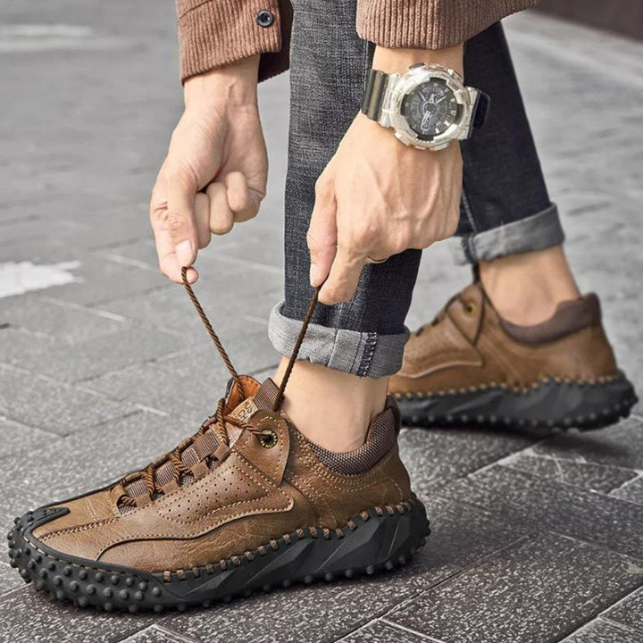 Robust outdoor lace-up shoes with studded tread