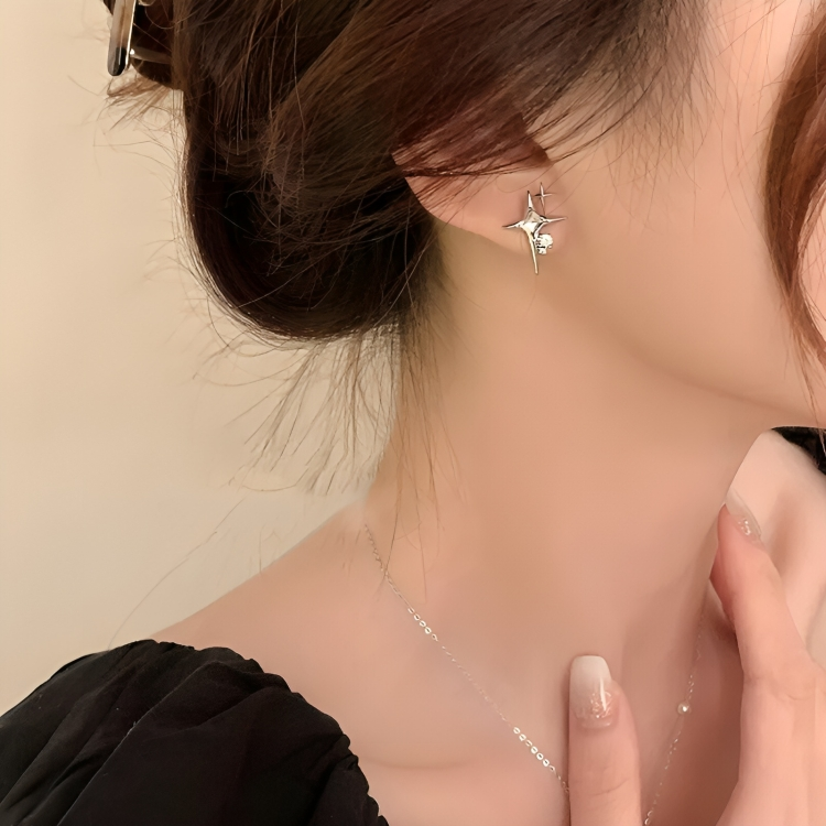 Star-shaped zirconia earrings with cross detail