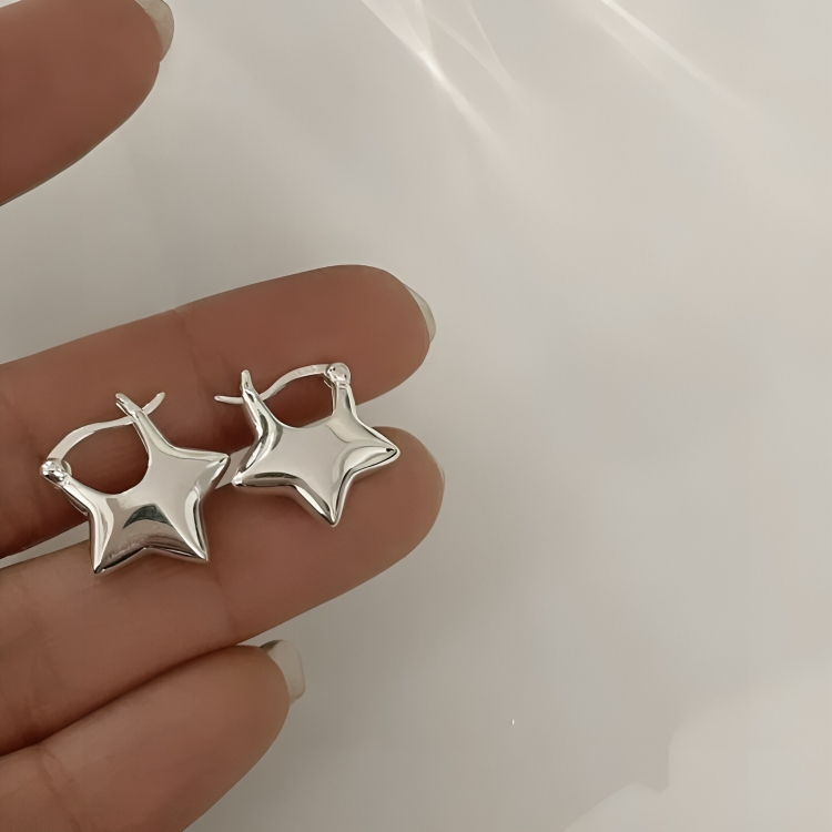Star-shaped zirconia earrings with cross detail