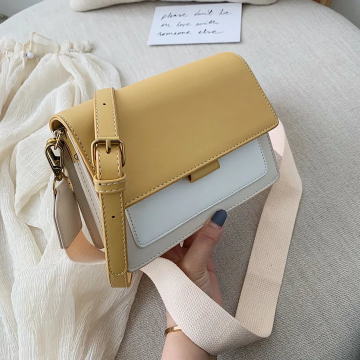 Ladies' crossbody bag in yellow leather with soft texture and flap fastening