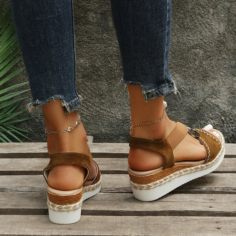 Sandals with snake print and wedge heel
