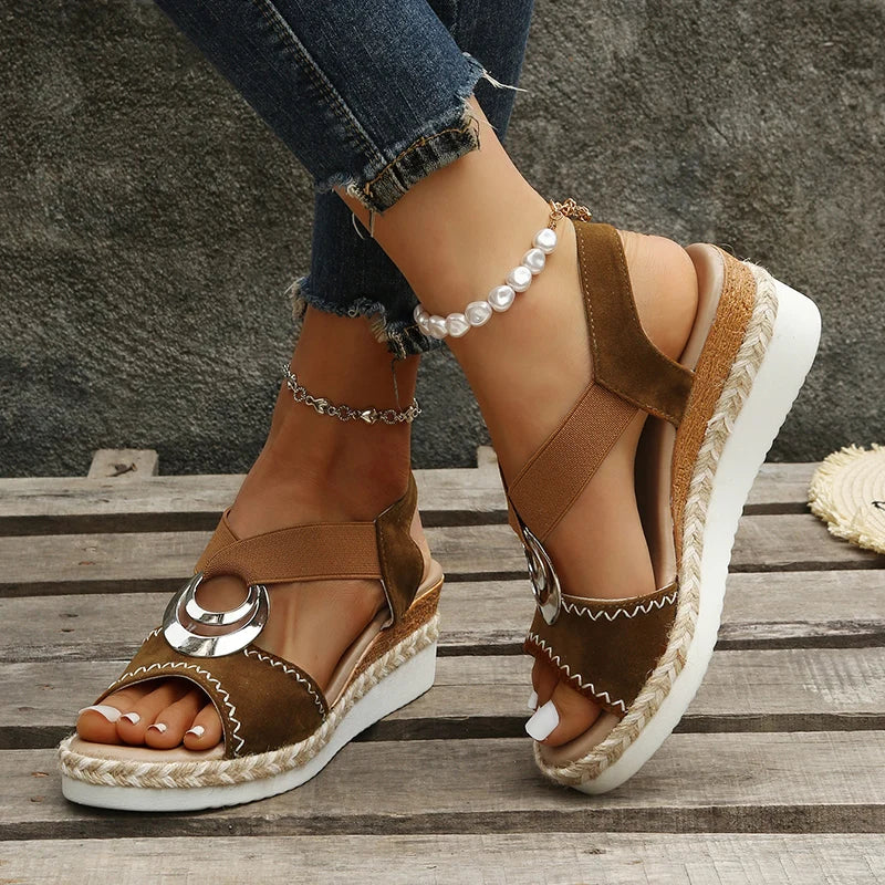 Sandals with snake print and wedge heel