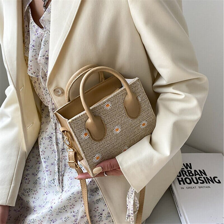 Woven handbag with floral accents