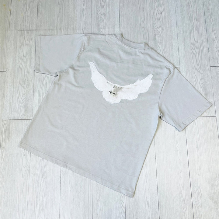 Retro-Inspired Loose Fit T-Shirt Featuring Charming Pigeon Design