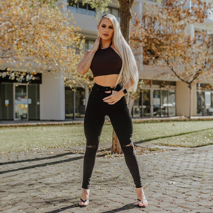 Trendy High-Waisted Black Skinny Jeans with Stylish Knee Rips